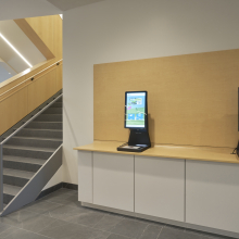 Lobby with stairs and self-check out machines